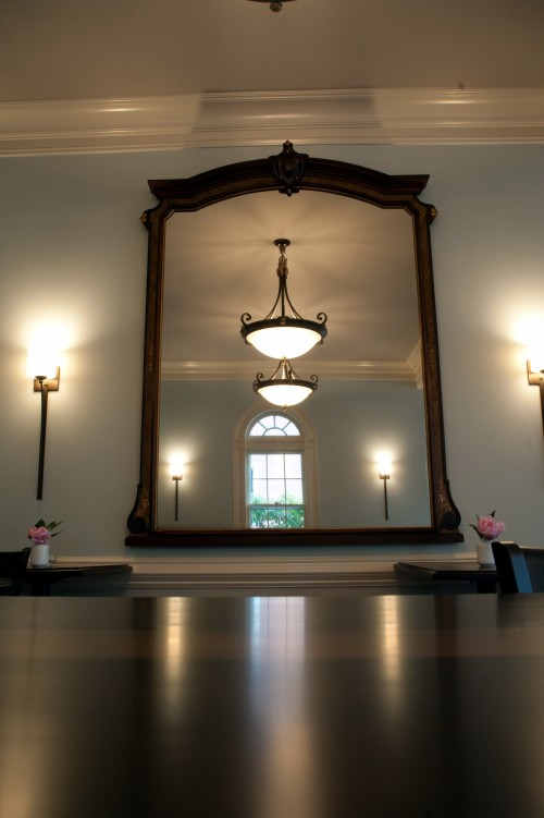 A mirror from the old Bank was reused as a focal point to reflect the light coming in from the south windows.