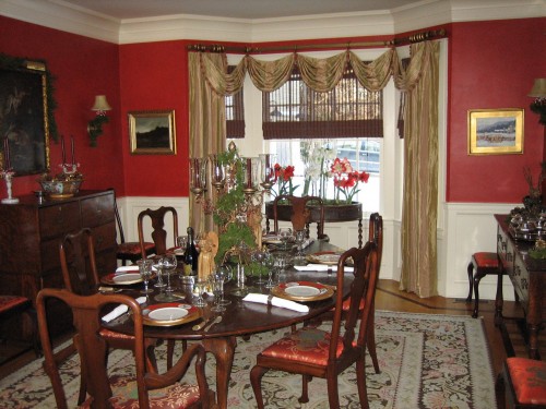 The red dining room accents the red and brown color theme throughout